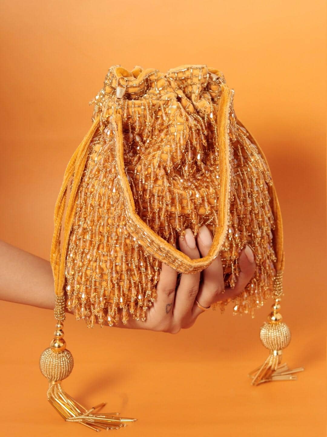 Gold Embellished Potli Bag with Decorative Handle