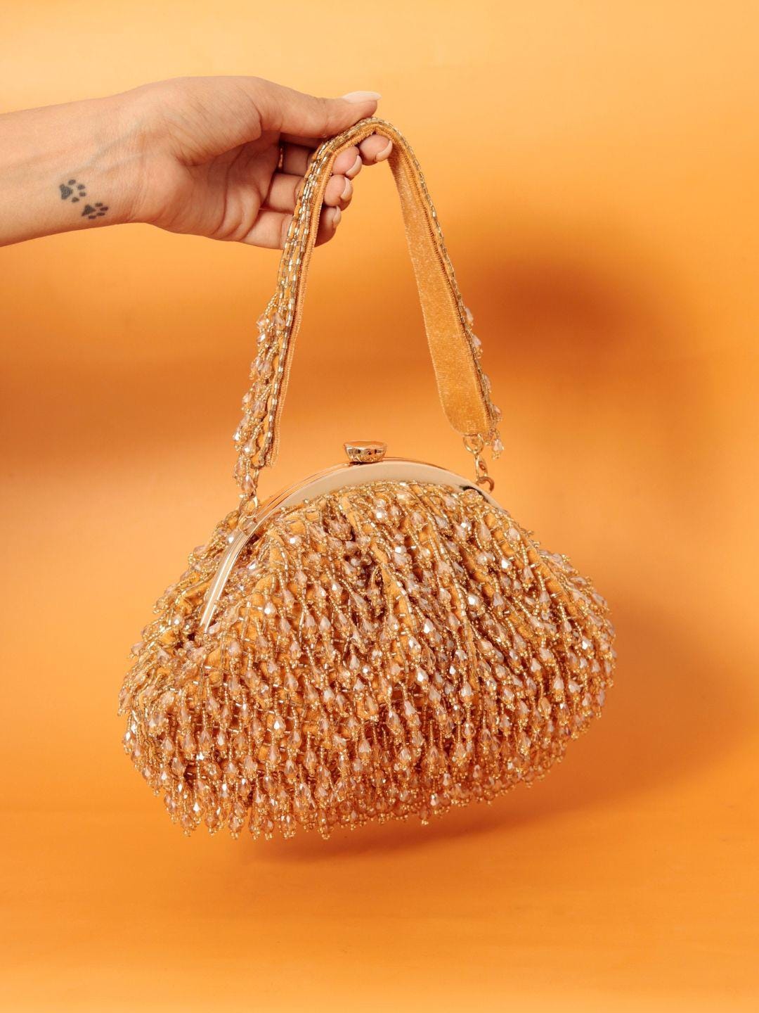 Gold Embellished Potli Bag with Decorative Handle